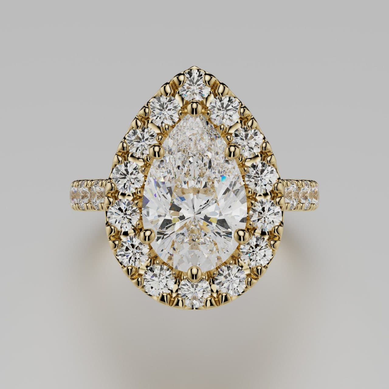 Pear-cut diamond halo engagement ring in yellow gold with a pavé band, top view — photorealistic 3D render by 4rend Studio