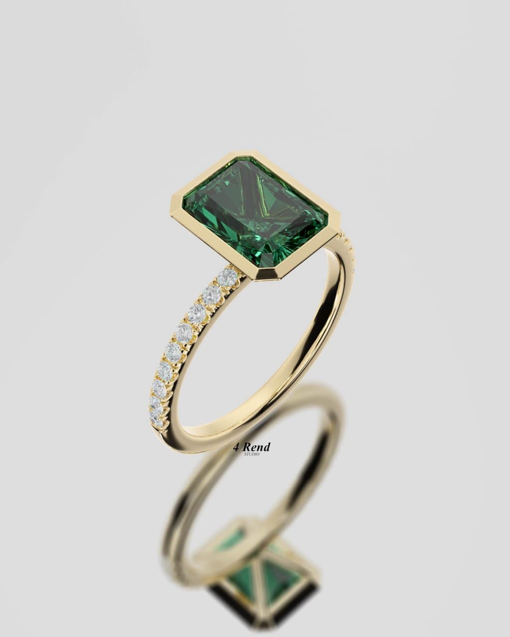 Green emerald-cut gemstone ring in yellow gold, three-quarter angle — bezel-set center stone and pavé shoulders, photoreal render