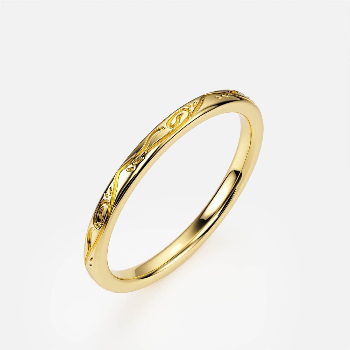 nanea Engraved Garden band in yellow gold with an engraved floral pattern