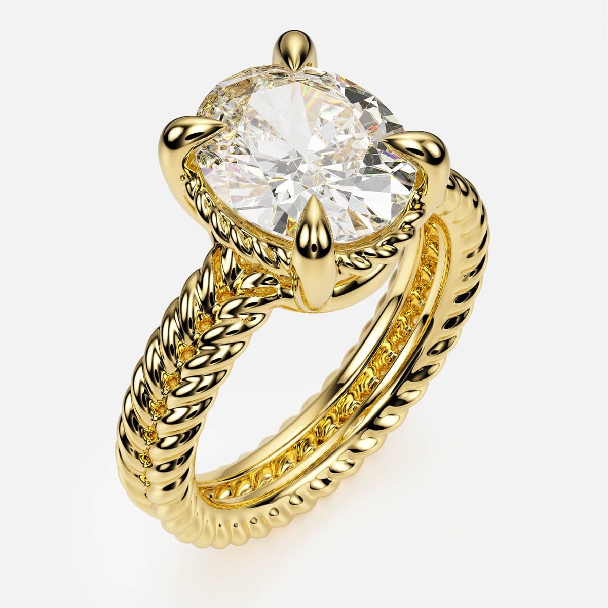nanea Twin Rope engagement ring in yellow gold, three-quarter view — an oval solitaire on a double twisted rope band