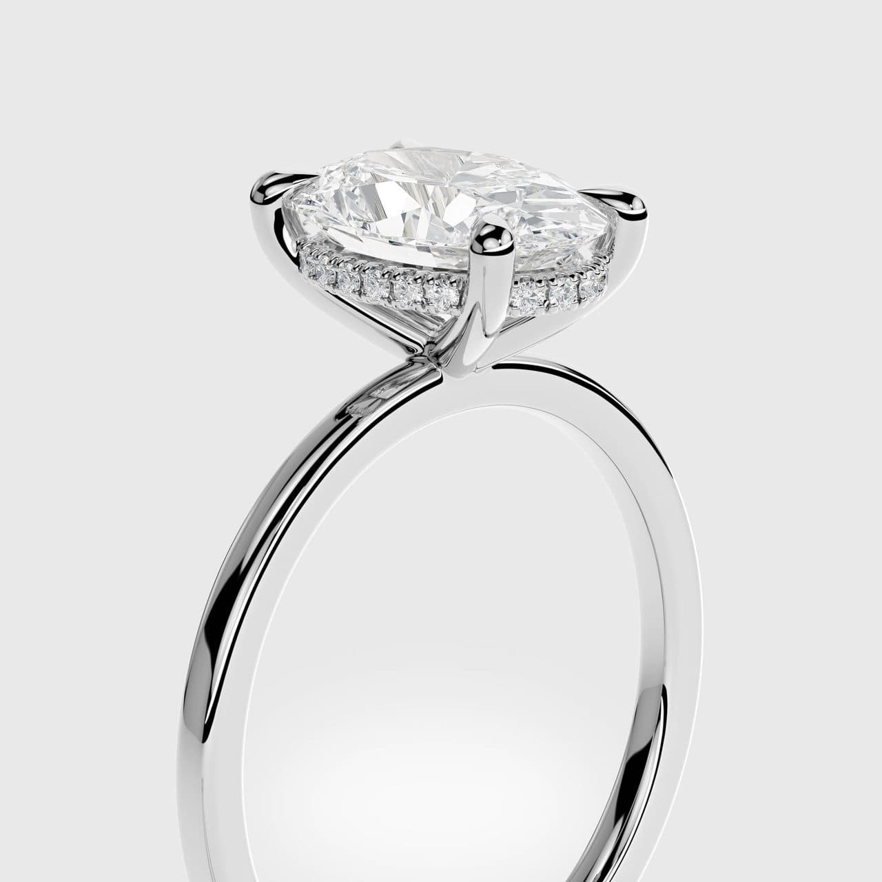 Close three-quarter view of a white gold oval diamond solitaire with a hidden halo of small diamonds under the centre stone, polished band catching the studio lights — photorealistic 3D render by 4rend Studio