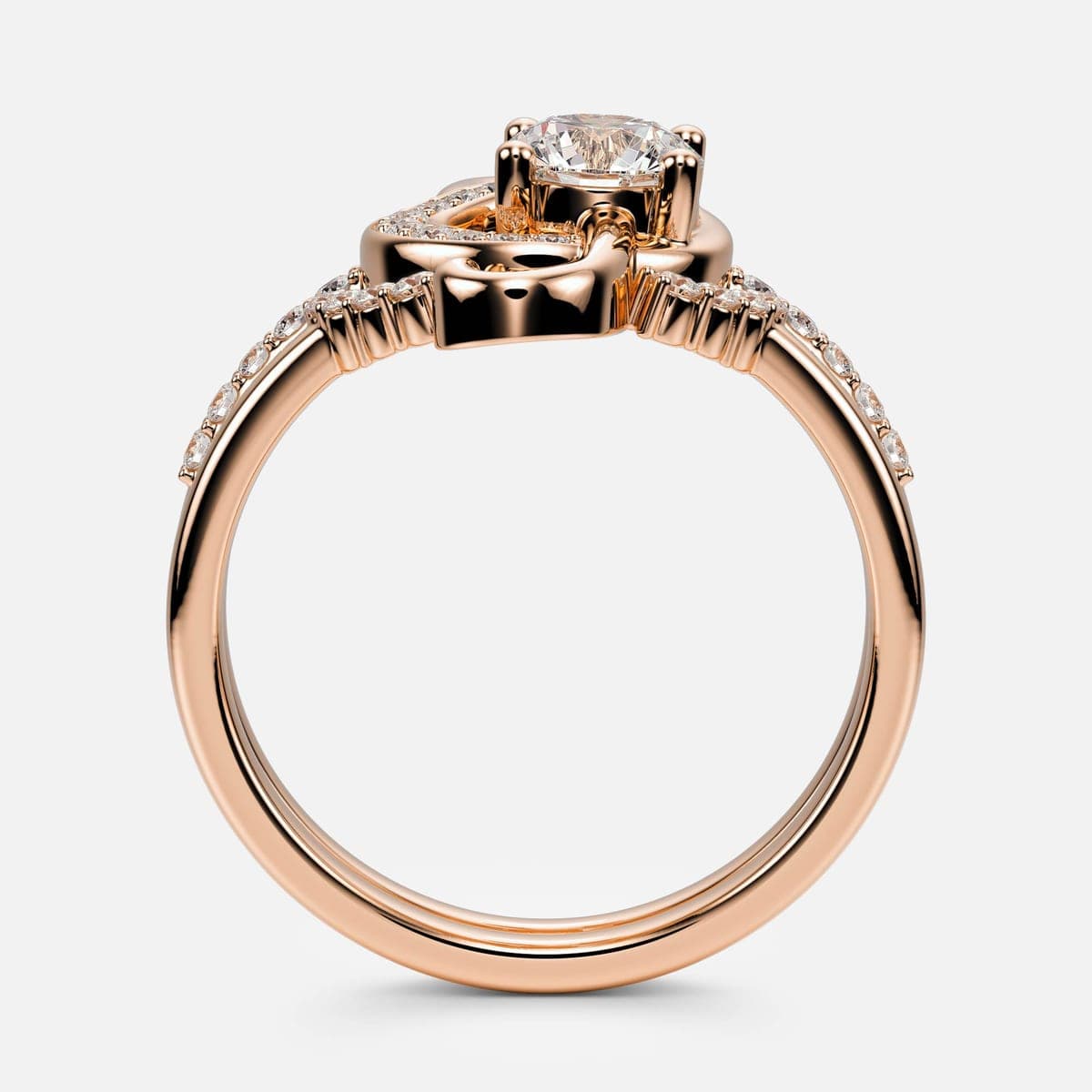 Front view of the rose gold treble-clef engagement ring and wedding band nested together