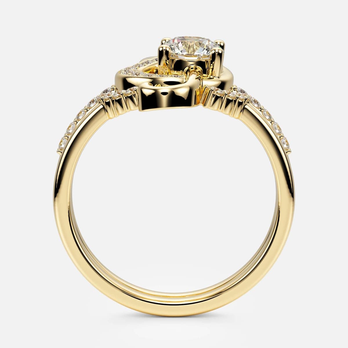 Front view of the yellow gold treble-clef engagement ring and wedding band nested together